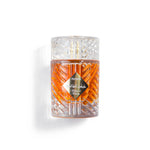 Decorative glass bottle with intricate design on a white background and similar to killian angles shares perfume