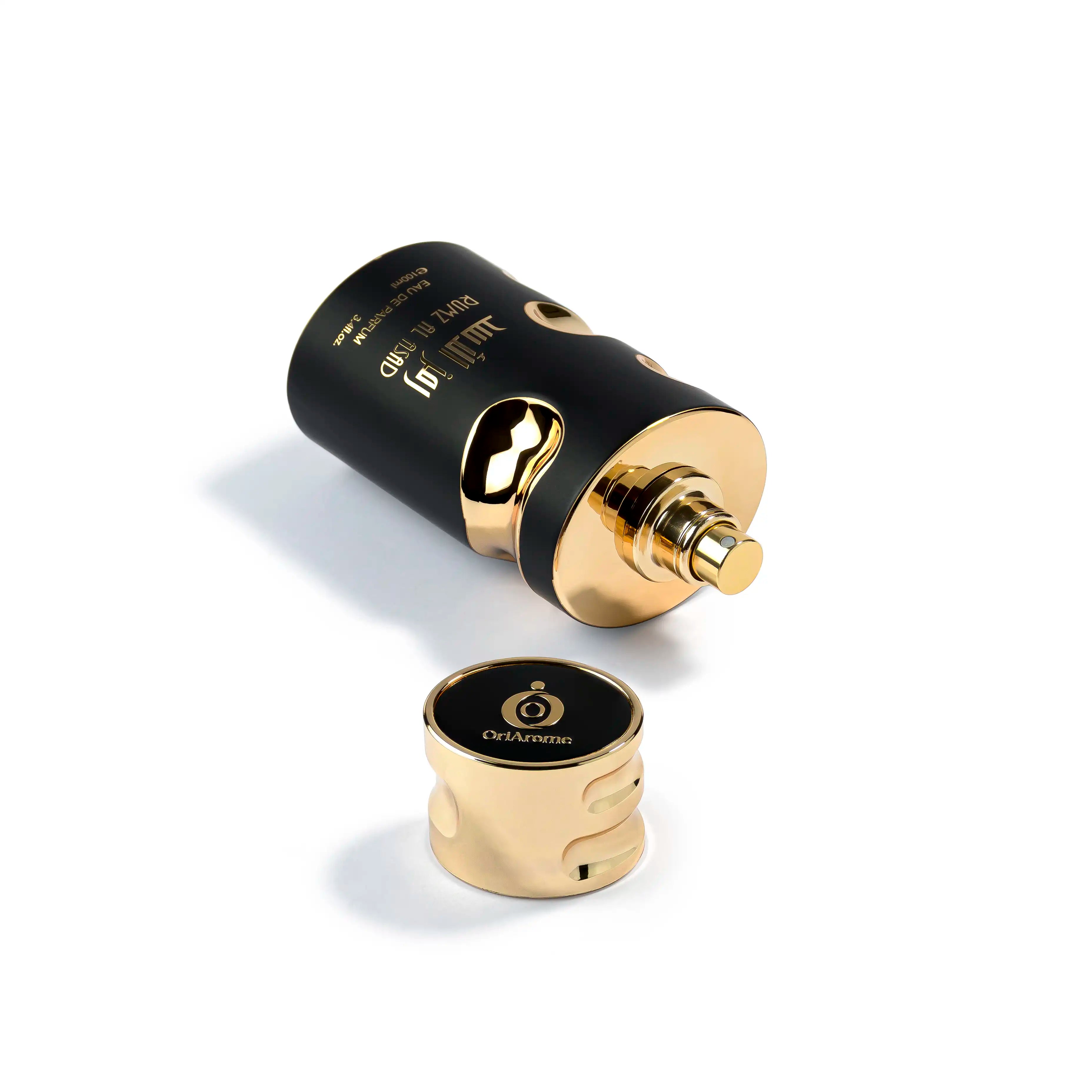 Black and gold rumz al asad bottle of shaikh saeed perfume and dupe of savage elixir